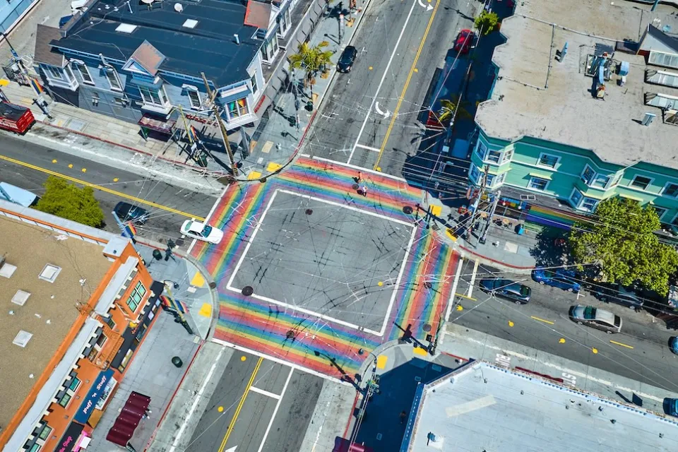 Aerial of rainbow painted crosswalks at large intersection in Castro District, Sna Francisco, California.